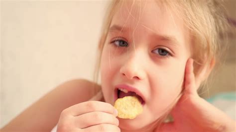 Indoor Snacking Young Girl Enjoying Chips Stock Footage Sbv 320353164