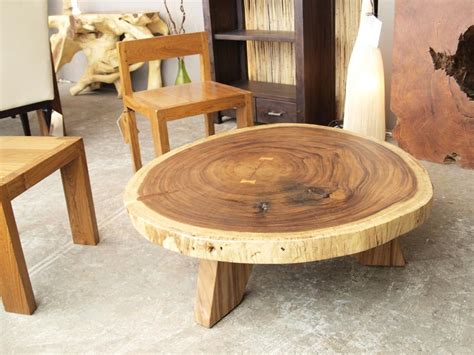 Crafted from reclaimed teak wood, this circular piece features an openwork design throughout its cylindrical frame. Wood Circle Coffee Table | Coffee Table Design Ideas
