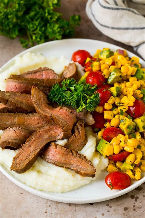 Instant pot mashed cauliflower with garlic and chives is the perfect low carb alternative to mashed potatoes, and made in a fraction of the time, thanks cauliflower is cooked in the instant pot until soft and then mashed with butter and sour cream. Grilled Flank Steak - Dinner at the Zoo
