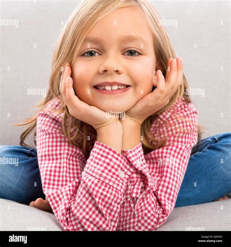 Little Girl Sitting On Couch Hi Res Stock Photography And Images Alamy