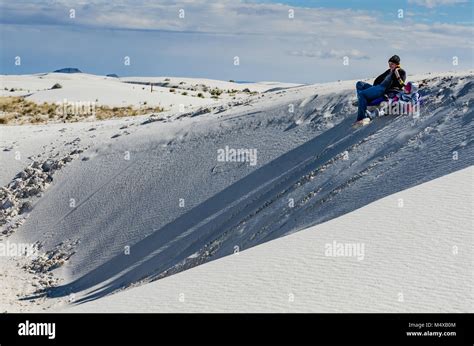 Sledding On The Beautiful Soft Gypsum Sand At White Sands National
