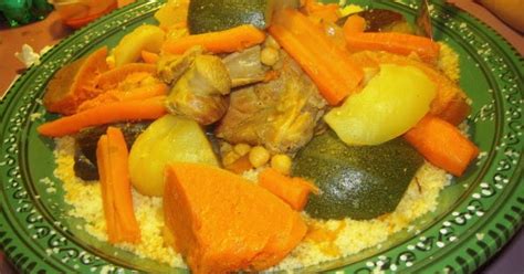 Traditional moroccan couscous is made of steamed semolina cooked for hours in a special pot and served with a delicious stew combining spicy vegetables, chickpeas and tender, and flavorful meat. Traditional Moroccan couscous with vegetables and lamb ...