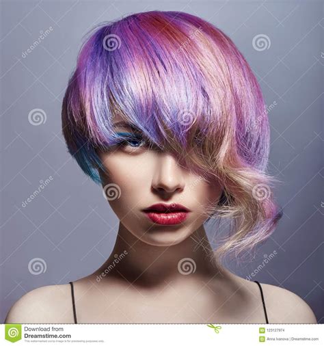 Portrait Of A Woman With Bright Colored Flying Hair All