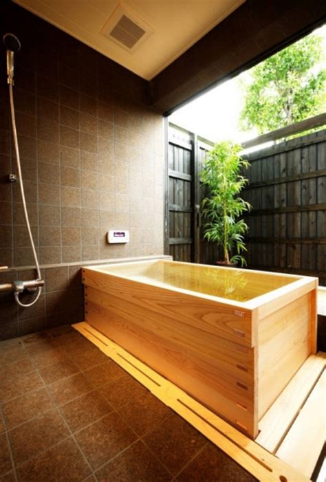 Shower water can drain through the space between the slats. japanese-soaking-bathtub-with-wooden-ideas | HomeMydesign