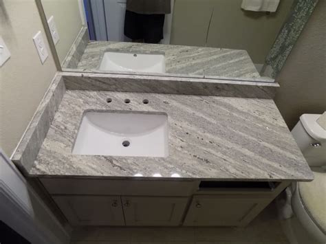 Resembling cracks on the icy surface of a frozen pond, the trademark dark veining on extreme white granite travels far and wide across the stone. Our Portfolio - Fox Granite Countertops - San Antonio