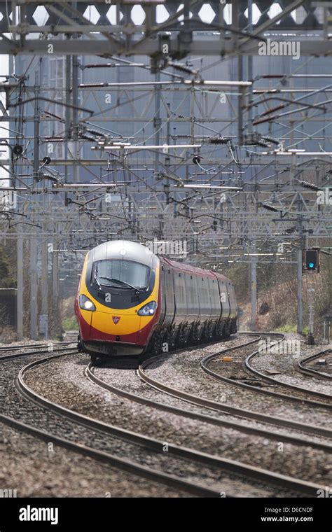 Virgin Pendolino Express Passenger Train Tilting Around The Bends At