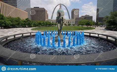 Blue Water Fountain With Runner Statue At Kiener Plaza Park In St