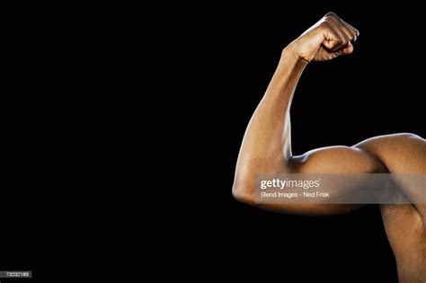Studio Shot Of African Man Flexing Biceps High Res Stock Photo Getty
