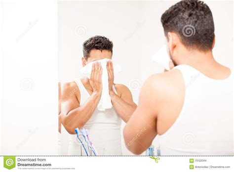 Everplush diamond jacquard bath towel set. Young Man Drying His Face With A Towel Stock Photo - Image ...