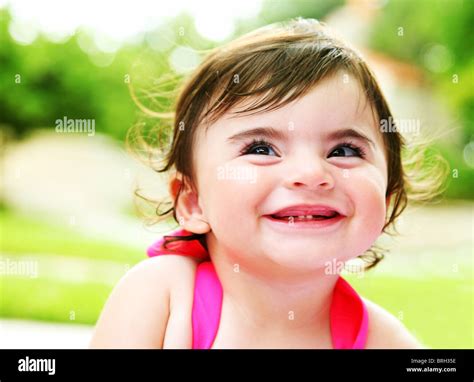 Happy Little Girl Laughing Closeup Portrait Outdoors Stock Photo Alamy
