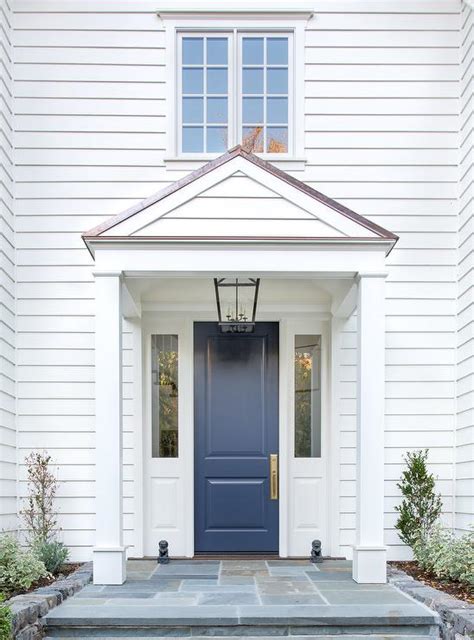Blue Front Door On White House Transitional Home Exterior