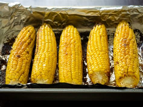 Place the corn directly on the oven rack and roast until the husk is brown and pulling away from the corn, about 30 minutes. The Most Amazing Oven-Roasted Corn - 12 Tomatoes
