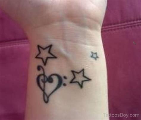 Star And Heart Tattoo On Wrist Tattoo Designs Tattoo Pictures
