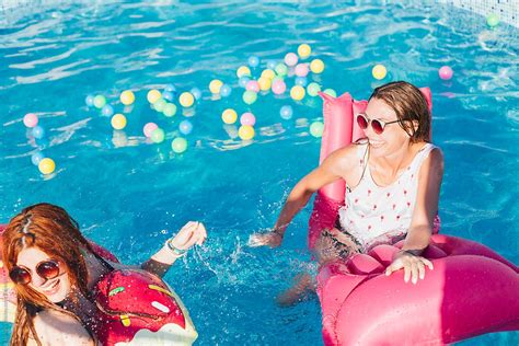 Girls Having Fun In The Swimming Pool By Stocksy Contributor Lumina Stocksy