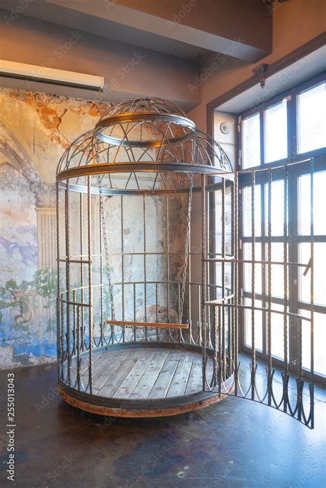iron huge round human cage with a swing inside bdsm furniture made of steel foto de stock
