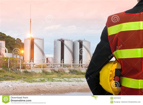 Hand Or Arm Of Engineer Hold Yellow Plastic Helmet Stock