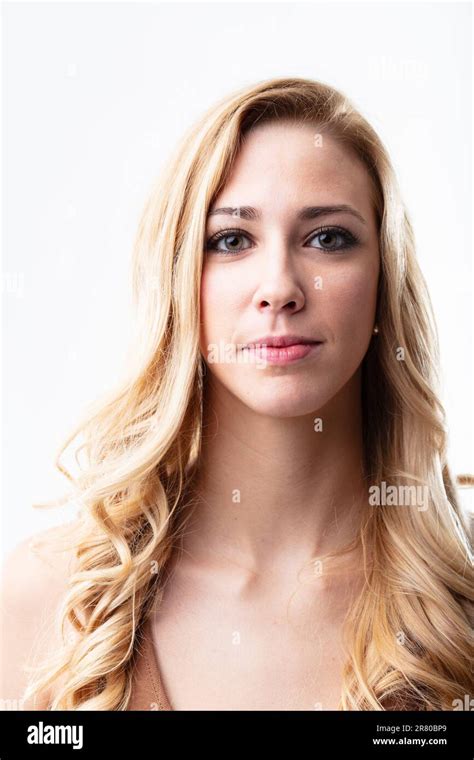 Front Facing Portrait Of A Confident Blonde Woman Her Silent Smile