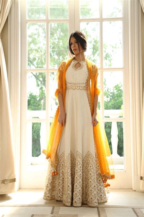White Anarkali With Gold Embroidery And Gold Dupattachunni Anarkali