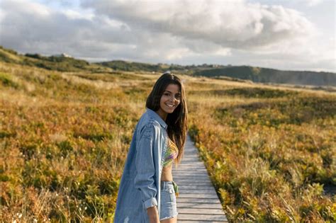 Spain Asturias Beautiful Young Woman On Boardwalk In The