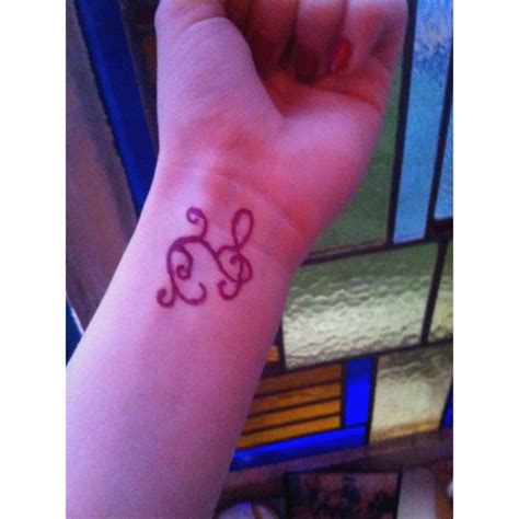 Rub baby powder on the tattoo. Using sharpie, baby powder and hairspray, make a temporary ...