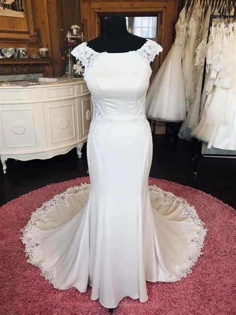 Don't miss out, shop clearance wedding dresses before they're gone! Size 12 Essense of Australia Wedding Dress