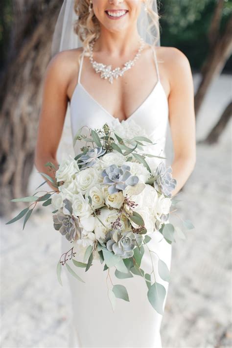 A boho lace wedding dress with spaghetti straps and a floral crown are a great idea for a boho chic wedding. 20 Succulent Wedding Bouquets Perfect for the Boho Bride ...