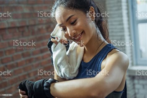 Asian Girl Exercising In Gym She Tired And She Has Sweat On Her Face