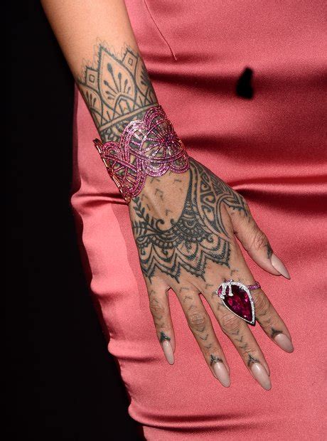 Her Henna Style Tatt On Her Hand A Guide To Rihannas Tattoos Her