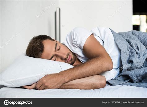 Man Sleeping In Bed Stock Photo By ©allaserebrina 168742734