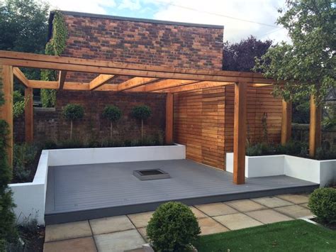 We built raised garden beds at several rentals prior to buying our little homestead. Scottish larch timber pergola, composite decking & white ...