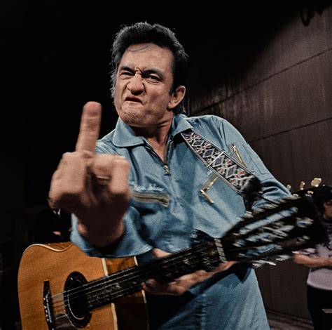 [colorized] johnny cash giving the finger during his 1969 san quentin state prison gig