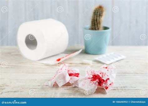 Sheets Of Toilet Paper With Blood On White Table Hemorrhoid Problems