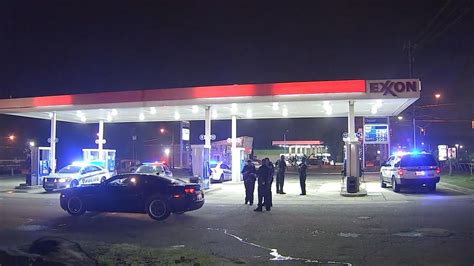 Police Cars Crowd Gas Station After Double Shooting