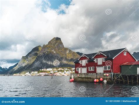 Famous Tourist Attraction Of Reine In Lofoten Norway With Red Rorbu