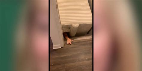 Woman Fails To Pivot While Moving Sofa Gets Stuck Under It For