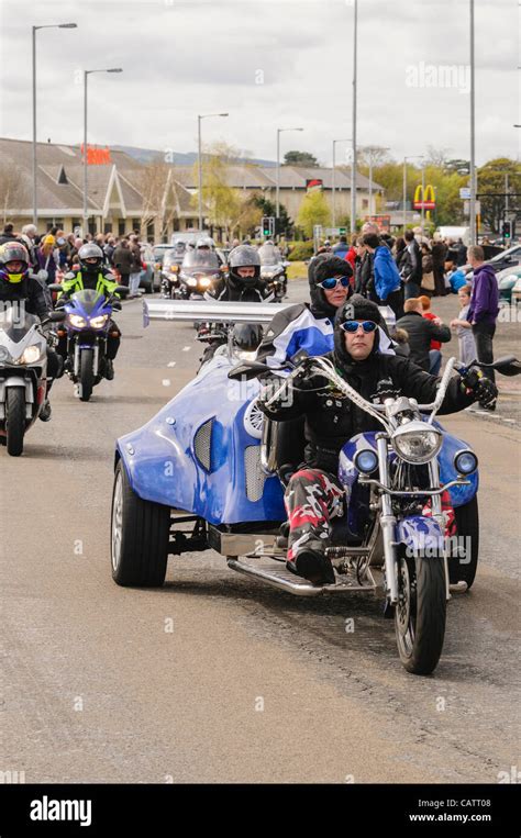 Biker Rides A Custom Built Tricycle On A Road During A Charity Ride Out