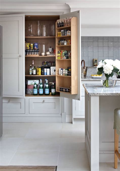 Looking for a pantry cabinet to reduce clutter and creating clean lines for more organized spaces. good use of pantry door | Kitchen pantry design, Pantry ...