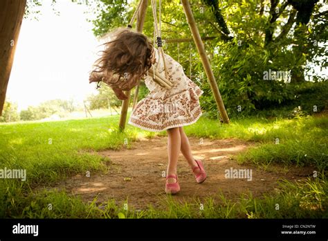 Young Girl On Swing Stock Photo Alamy