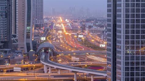 Dubai Downtown Skyline Night To Day And Sheikh Zayed Road Traffic Uae