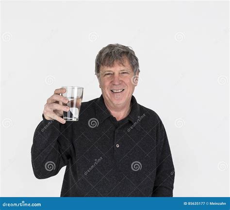 Portrait Of Cool Looking Handsome Man Drinking A Glass Of Water Stock