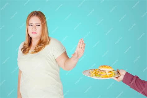 premium photo overweight woman refusing to eat junk food