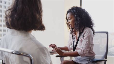 Woman Having Consultation With Female Doctor Stock Footage Sbv
