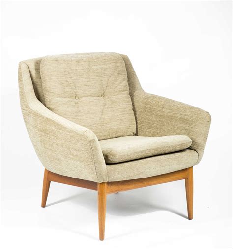 A pair of reproduction armchairs in the 1940s danish modern style. Three Danish Modern Upholstered Armchairs