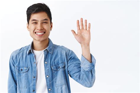 Free Photo Close Up Portrait Of Friendly Attractive Asian Man Waving
