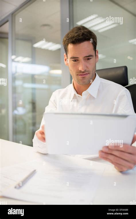 Businessman In Office Working On Computer Tablet Stock Photo Alamy