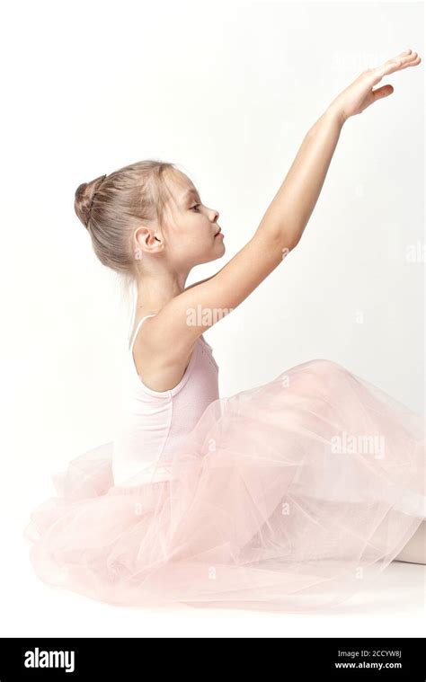 Girl Ballerina In Pink Dance Costume Ballet Dance Pointe Shoes Tutu Light Background Model Stock