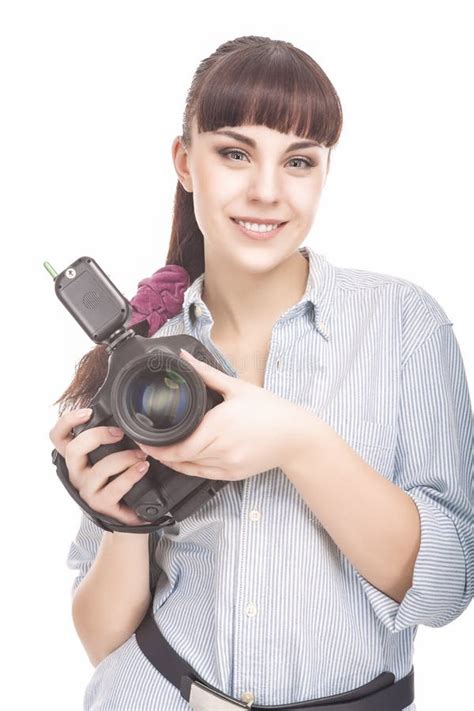 Female Photographer Holding A Professional Camera And Smiling Stock
