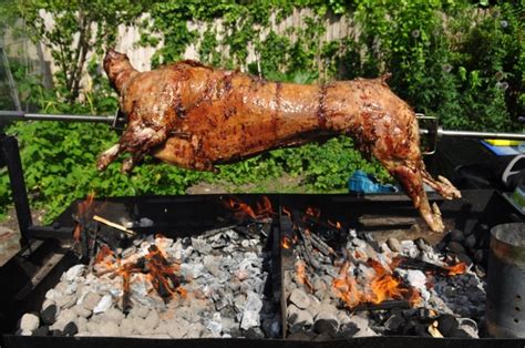 Cooking a lamb on a spit for greek easter. How to Spit Braai Lamb