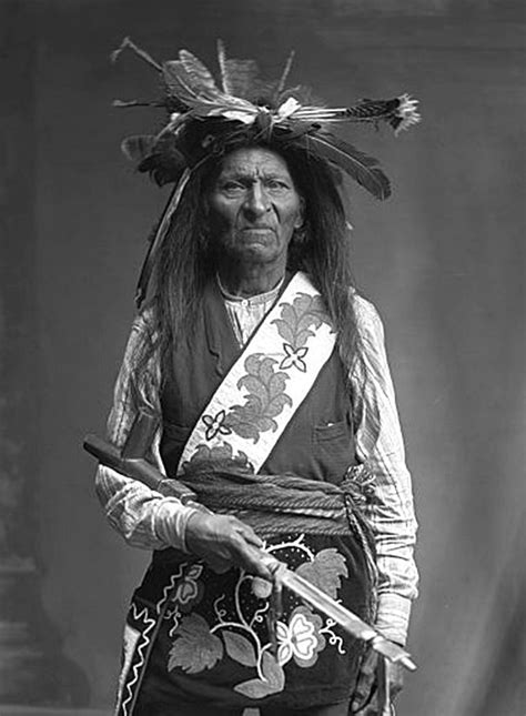 An Old Black And White Photo Of A Native American Man