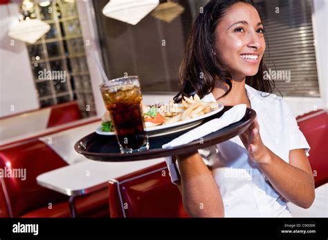 African American Waitress Serving Lunch Stock Photo Alamy
